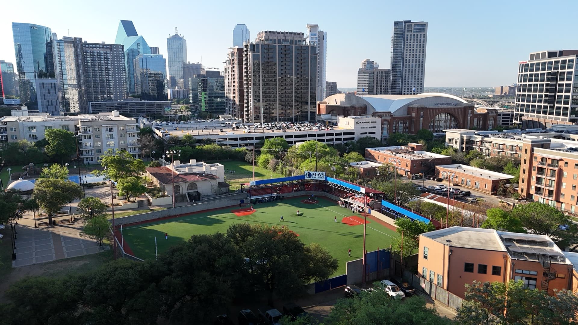 Aerial drone photo of professional baseball field with downtown skyline in background